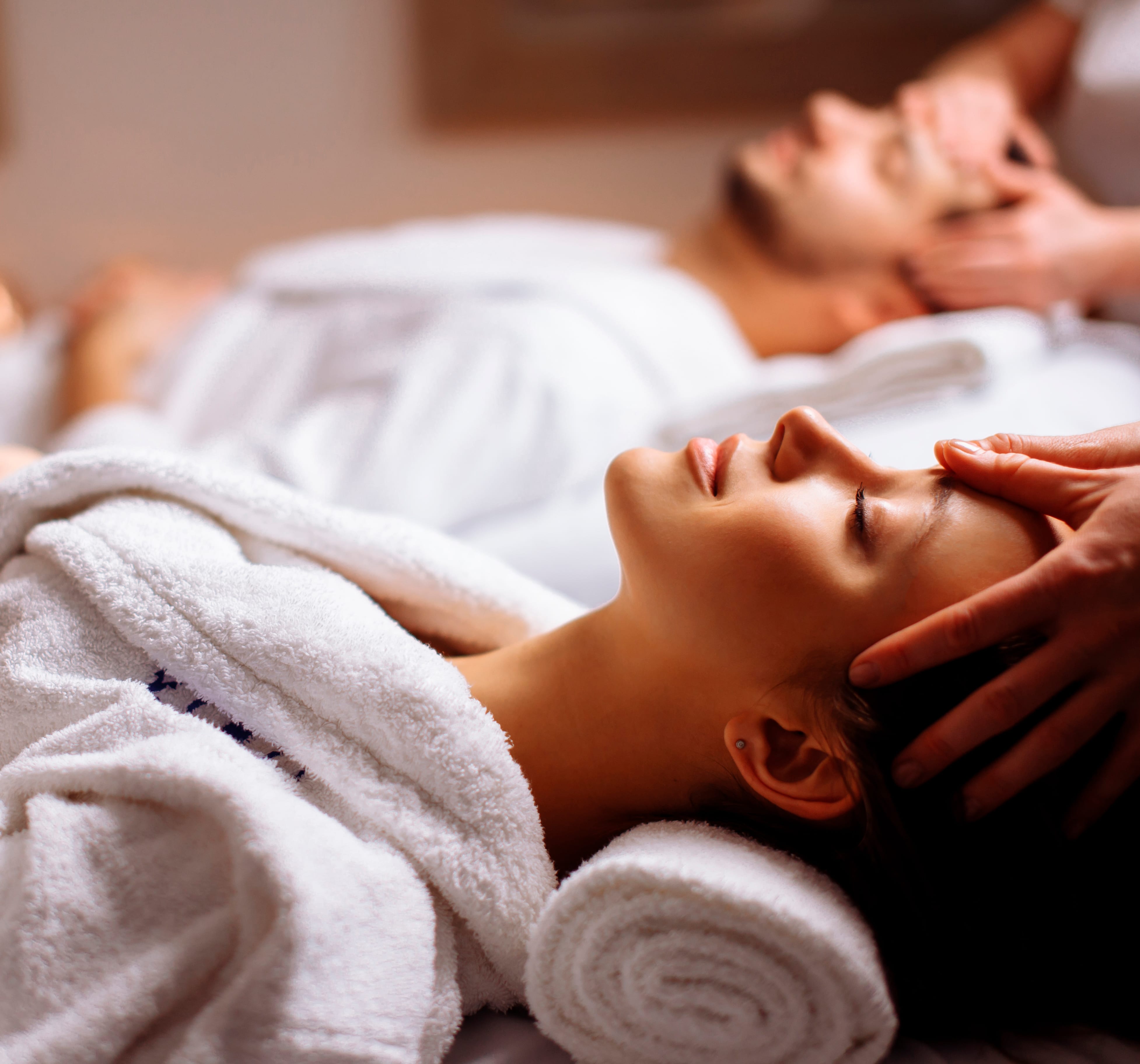 Couple enjoying a relaxing spa treatment in luxurious surroundings | MSC Cruises Couple enjoying a relaxing spa treatment in luxurious surroundings | MSC Cruises